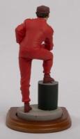 NIKI LAUDA: A 1:9 scale limited edition (0972/5000) cold cast porcelain resin figure of Niki Lauda&nbsp;sculpted by Paul Szeiler for Endurance Ltd, on wooden base with engraved plaque, NIB and accompanied by a COA from The Art of Sport, 22cm high - 3