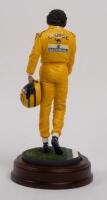 AYRTON SENNA: A 1:9 scale limited edition (3949/5000) cold cast porcelain resin figure of Ayrton Senna&nbsp;sculpted by Paul Szeiler for Endurance Ltd, on wooden base with engraved plaque, NIB and accompanied by a COA from The Art of Sport, 22cm high - 3