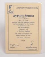 AYRTON SENNA: A 1:9 scale limited edition (3949/5000) cold cast porcelain resin figure of Ayrton Senna&nbsp;sculpted by Paul Szeiler for Endurance Ltd, on wooden base with engraved plaque, NIB and accompanied by a COA from The Art of Sport, 22cm high - 4