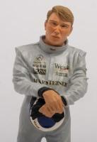 MIKA HAKKINEN: A 1:9 scale limited edition (0563/5000) cold cast porcelain resin figure of Mika Hakkinen&nbsp;sculpted by Paul Szeiler for Endurance Ltd, on wooden base with engraved plaque, NIB and accompanied by a COA from The Art of Sport, 22cm high - 2