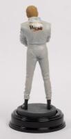 MIKA HAKKINEN: A 1:9 scale limited edition (0563/5000) cold cast porcelain resin figure of Mika Hakkinen&nbsp;sculpted by Paul Szeiler for Endurance Ltd, on wooden base with engraved plaque, NIB and accompanied by a COA from The Art of Sport, 22cm high - 3
