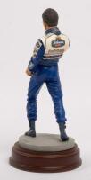 DAMON HILL: A 1:9 scale limited edition (0616/5000) cold cast porcelain resin figure of Damon Hill sculpted by Paul Szeiler for Endurance Ltd, on wooden base with engraved plaque, NIB and accompanied by a COA from The Art of Sport, 22cm high - 3