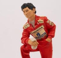 AYRTON SENNA: A 1:9 scale limited edition (0154/5000) cold cast porcelain resin figure of Ayrton Senna&nbsp;sculpted by Paul Szeiler for Endurance Ltd, on wooden base with engraved plaque, NIB and accompanied by a COA from The Art of Sport, 22cm high - 2