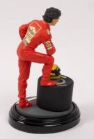 AYRTON SENNA: A 1:9 scale limited edition (0154/5000) cold cast porcelain resin figure of Ayrton Senna&nbsp;sculpted by Paul Szeiler for Endurance Ltd, on wooden base with engraved plaque, NIB and accompanied by a COA from The Art of Sport, 22cm high - 3