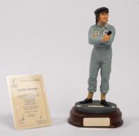JACKIE STEWART: A 1:9 scale limited edition (0381/5000) cold cast porcelain resin figure of Jackie Stewart&nbsp;sculpted by Paul Szeiler for Endurance Ltd, on wooden base with engraved plaque, NIB and accompanied by a COA from The Art of Sport, 22cm high