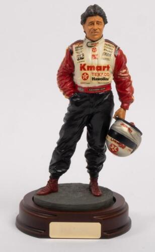 MARIO ANDRETTI: A 1:9 scale limited edition cold cast porcelain resin figure of Mario Andretti sculpted by Paul Szeiler for Endurance Ltd, on wooden base with engraved plaque, 22cm high
