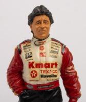 MARIO ANDRETTI: A 1:9 scale limited edition&nbsp;cold cast porcelain resin figure of Mario Andretti&nbsp;sculpted by Paul Szeiler for Endurance Ltd, on wooden base with engraved plaque,&nbsp;22cm high - 2
