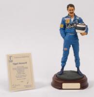 NIGEL MANSELL: A 1:9 scale limited edition (1403/5000) cold cast porcelain resin figure of Nigel Mansell&nbsp;sculpted by Paul Szeiler for Endurance Ltd, on wooden base with engraved plaque, NIB and accompanied by a COA from The Art of Sport, 22cm high