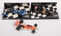 McLAREN TYRRELL WOLF: A group lot of formula 1 race cars, a McLaren M26, number 1 as driven by James Hunt in 1977, manufactured by Eidaico models,&nbsp;a Tyrrell 003, number 12 as driven by Jackie Stewart in 1971, manufactured by Minichamps, and a Wolf Ford WR