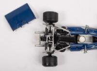 McLAREN TYRRELL WOLF: A group lot of formula 1 race cars, a McLaren M26, number 1 as driven by James Hunt in 1977, manufactured by Eidaico models,&nbsp;a Tyrrell 003, number 12 as driven by Jackie Stewart in 1971, manufactured by Minichamps, and a Wolf Ford WR - 2