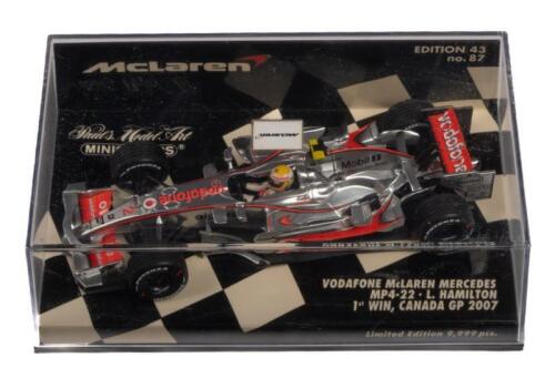 McLAREN MERCEDES MP4-22: A 1:43 scale Minichamps Vodafone McLaren Mercedes MP4-22 as raced by Lewis Hamilton to his 1st win Canada grand prix 2007
