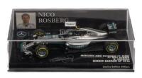 MERCEDES AMG PETRONAS F1 W07: A 1:43 scale Minichamps Mercedes AMG Petronas F1 team, F1 W07 hybrid as raced to victory by Nico Rosberg Bahrain 2016