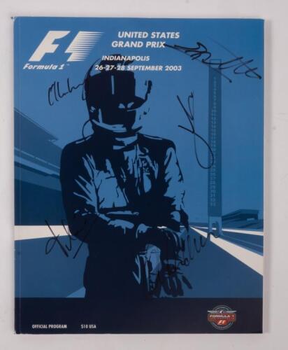 USA: A autographed Formula 1 race programme from the 2003 USA GP, signed by, Michael Schumacher, Kimi Reikkonen, Rubens Barrichello and others.