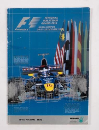 MALAYSIAN: A autographed Formula 1 race programme from the 2000 Malaysian GP Kuala Lumpur, signatures include, Michael Schumacher, Mika Hakkinen, David Coulthard and 15 others drivers.