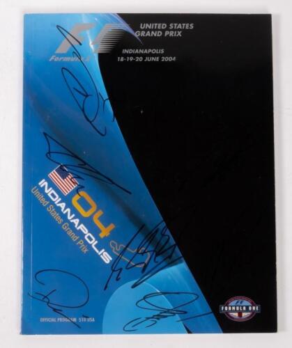 USA: A autographed Formula 1 race programme from the 2004 USA GP Indianapolis, signed by, Michael Schumacher, Kimi Raikkonen, Jenson Button and 5 other drivers.