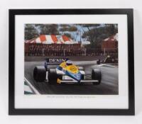 ROSBERG: A print after the original by Eric Irvine titled - 'Winner of the 1985 Australian Grand Prix, Keke Rosberg, leads Ayrton Senna', numbered 65/1000; framed and glazed 53cm high, 62cm wide&nbsp;overall.