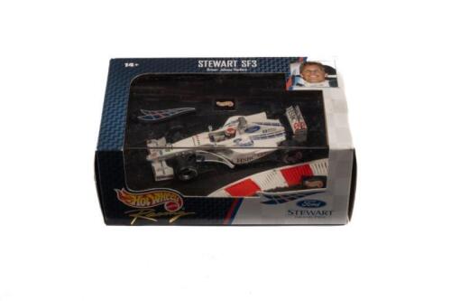 STEWART SF3: A 1:43 scale Hot Wheels racing Stewart SF3, as raced by Johnny Herbert in 1999