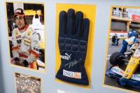 ALONSO: A box&nbsp;framed collage relating to F1 World Champion Driver Fernando Alonso, including Puma 'ING' racing glove with Fernando Alonso signature surrounded by four photographs and plaque. Measures 84cm wide, 59cm high. - 2