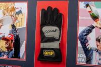WEBBER:&nbsp;A box&nbsp;framed &&nbsp;collage relating to successful F1&nbsp;driver Mark Webber, including OMP racing glove with Mark Webber&nbsp;signature surrounded by four photographs and plaque. Measures 84.5cm wide, 59cm high. - 2