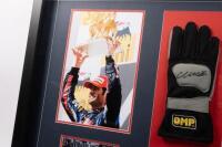 WEBBER:&nbsp;A box&nbsp;framed &&nbsp;collage relating to successful F1&nbsp;driver Mark Webber, including OMP racing glove with Mark Webber&nbsp;signature surrounded by four photographs and plaque. Measures 84.5cm wide, 59cm high. - 3