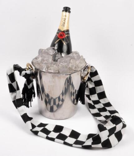 HANDBAG: A novel hand bag in the shape of a champagne bottle on ice with ice bucket by automotive artist Terry Lawrie