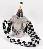 HANDBAG: A novel hand bag in the shape of a champagne bottle on ice with ice bucket by automotive artist Terry Lawrie