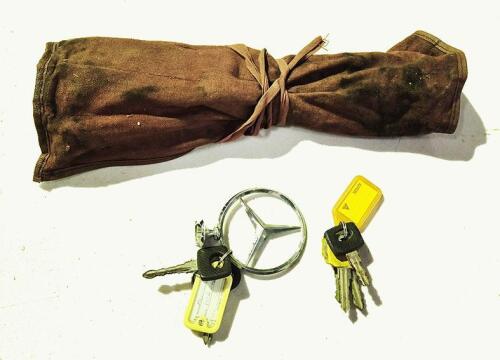 MERCEDES-BENZ TOOL ROLL: A mercedes benz tool roll with tools, spanners, wheel brace, spark plug remover etc, plus a group lot of various keys