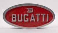 PLAQUE: A solid aluminium&nbsp;oval plaque, 24.5cm wide, 2.5cm high