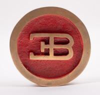 PAPERWEIGHT: A solid brass 'EB' paperweight, 10cm diameter