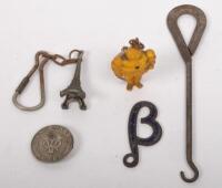 KEY RINGS: An assortment of items, including a Michelin Man key ring, an Eiffel Tower key ring, Lancia, a vintage 'B' (Beta) key ring, a Vauxhall&nbsp;lapel pin and also a vintage metal shoe lace button hook