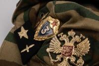 USSR: A Soviet Military styled hat with patches either side of the hat and various pins. - 3