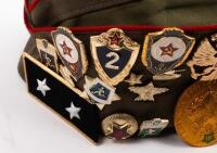 USSR: A Soviet Military styled Garrison hat, green with red piping. Fitted with various Soviet era pins and three patches attached. - 4
