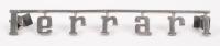 FERRARI: A circa 1960s/1970s early three rear pin Ferrari badge