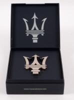 MASERATI: A chromed metal Maserati Trident logo paperweight/desk piece within original box from the Maserati Collection.&nbsp;