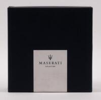 MASERATI: A chromed metal Maserati Trident logo paperweight/desk piece within original box from the Maserati Collection.&nbsp; - 2