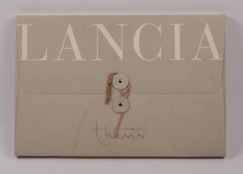 LANCIA THESIS: A rare copy of 'Thesis', hardcover cloth covered book, presented in special cardboard enclosed fold up cover, published in 2002 by Lancia Marketing