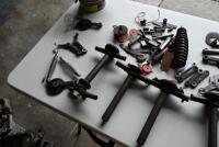 NORTON: Large quantity of Norton/Webb fork parts including headstocks, triple clamps, new bolts, headtock bearings, reconditioned side links, circa mid 1930s-1940s [Location: Sydney] - 3