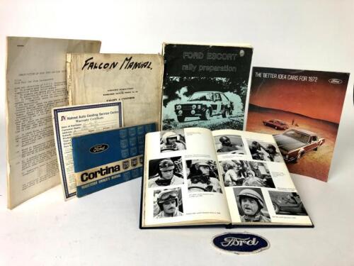 FORD: A collection of Ford items. Owners Manuals, brochure, badges