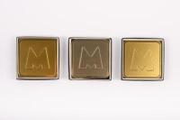 MATCHLESS: A collection of eighteen Matchless plain 'M' logo coasters, each 9.5cm square [Location Cheltenham, VIC]&nbsp;