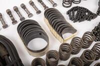 DB6: A collection of Aston Martin DB6 parts including a new pair of steering rack mounts, pair of electric cables for Selecta-Ride shock absorbers, as well as selection of used parts such as conrod nuts and bolts, valves, springs, collets, timing chains, - 10