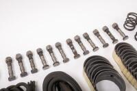 DB6: A collection of Aston Martin DB6 parts including a new pair of steering rack mounts, pair of electric cables for Selecta-Ride shock absorbers, as well as selection of used parts such as conrod nuts and bolts, valves, springs, collets, timing chains, - 11