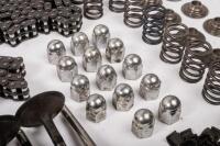 DB6: A collection of Aston Martin DB6 parts including a new pair of steering rack mounts, pair of electric cables for Selecta-Ride shock absorbers, as well as selection of used parts such as conrod nuts and bolts, valves, springs, collets, timing chains, - 12