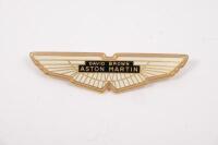 DB 4/5/6/DBS: An original gold 'DAVID BROWN, ASTON MARTIN' bonnet/boot badge. Suitable for Aston Martin DB 4,5, 6 and DBS. Part No. 030-004-0035G