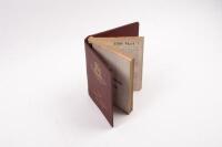 REGISTER: A 1979 edition of Aston Martin Owners Club register book within red vinyl binder folder, gold gilt writing to cover. Pages with damage, including water damage and foxing. - 2