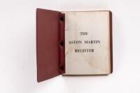 REGISTER: A 1979 edition of Aston Martin Owners Club register book within red vinyl binder folder, gold gilt writing to cover. Pages with damage, including water damage and foxing. - 3