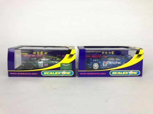 SCALEXTRIX: Two unused 1:32 scale Scalextrix slot cars. Aston Martin Racing DBR9 and Nissan Skyline GTR
