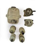 AMV8: AMV8 fluid containers. Four brake and clutch fluid containers and one coolant header tank