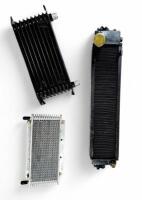 DB6: Original oil cooler plus two other NOS oil coolers