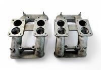 AMV8: One pair of carburettor intake manifolds.