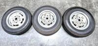 DBSV8/AMV8 WHEELS: Three road wheels, all with tyres.
